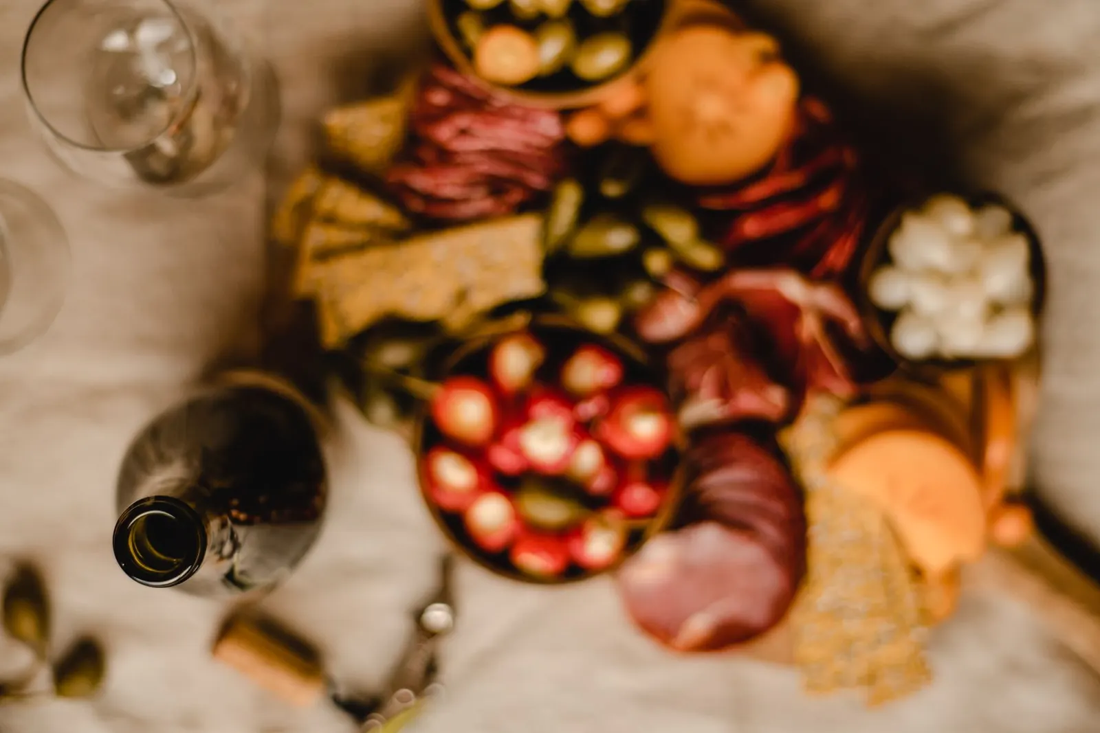 A grazing board with cheese and wine