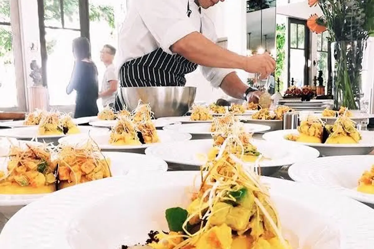 A chef plating dinner